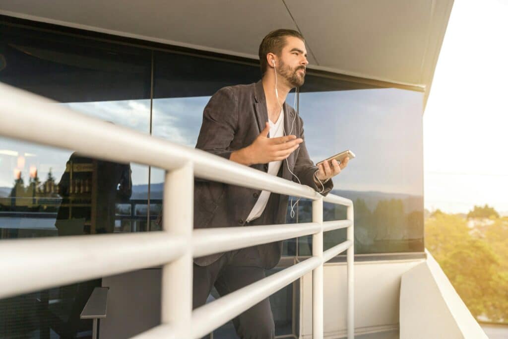 man talking on balcony