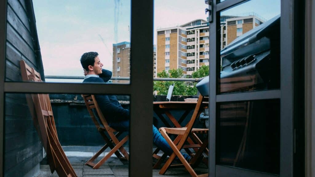 business professional sitting on balcony