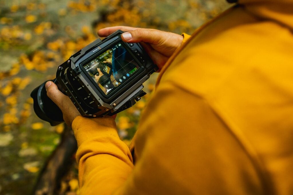 photographer with yellow jacket