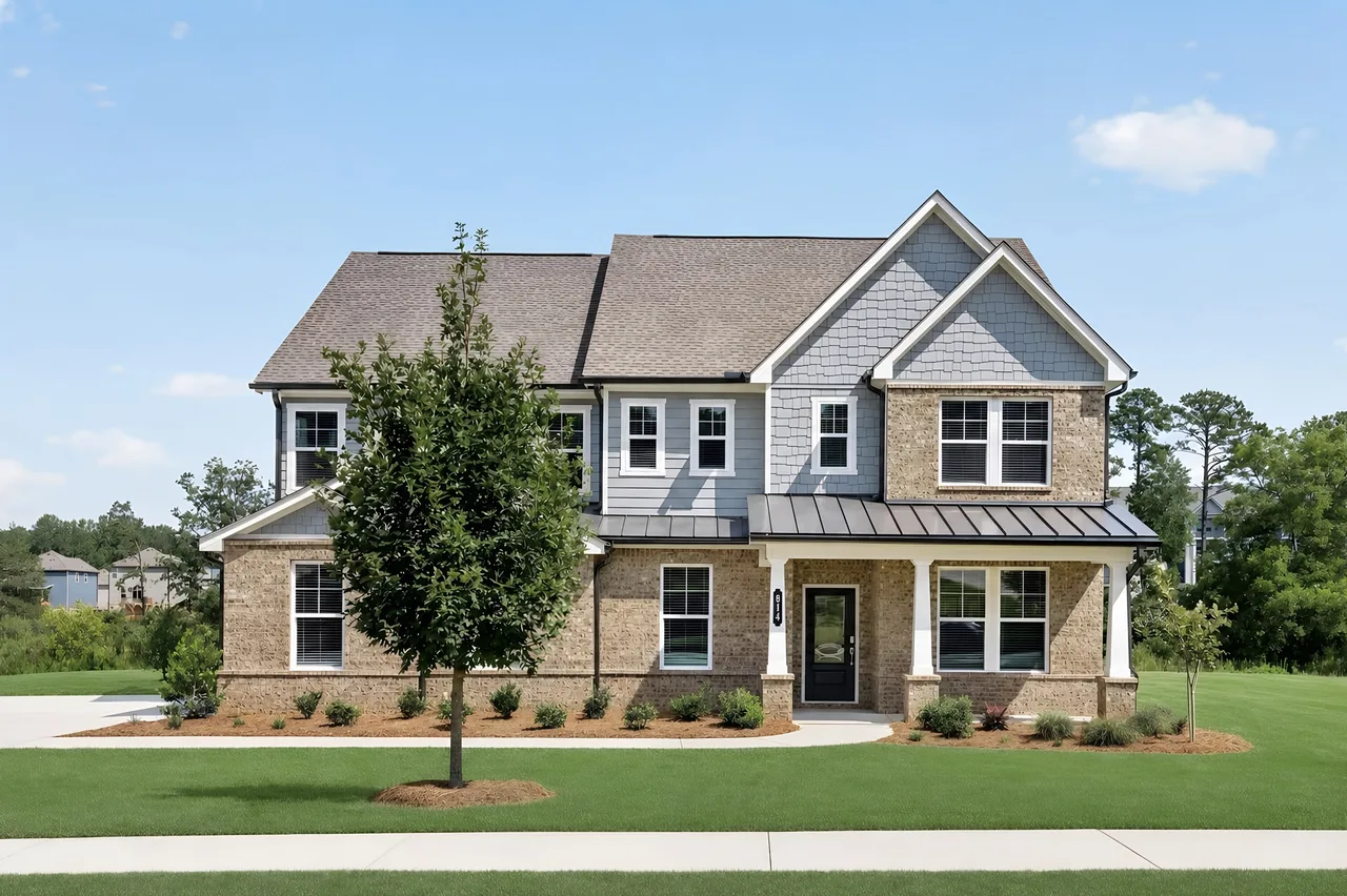 Professionally photographed two-story brick and stone home exterior with a manicured lawn, the kind of polished real estate photo buyers see online