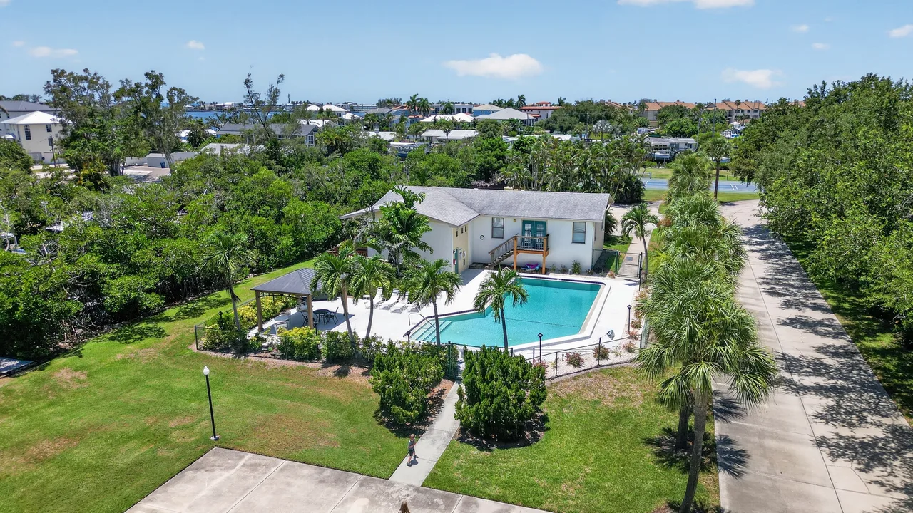 Aerial photo of a home and pool area showing the property in the context of its actual surroundings