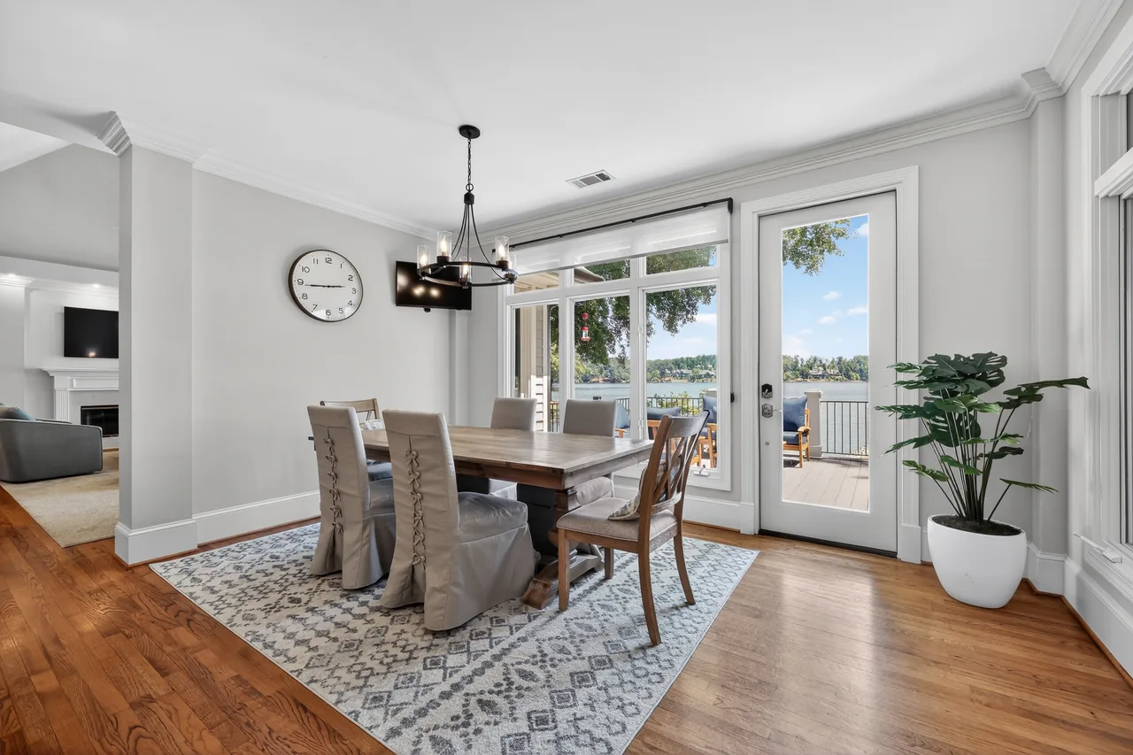 Bright, well-lit interior dining room with natural light balanced through window — an example of proper exposure correction in real estate photography