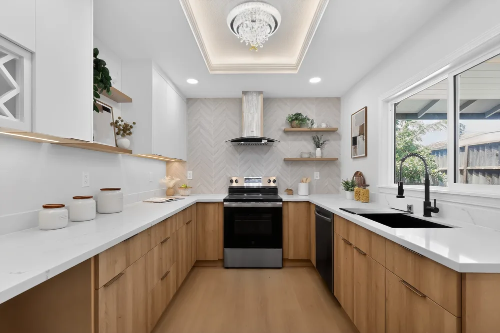 Newly renovated kitchen with custom wood cabinetry and quartz countertops, an example of listing-prep work sellers often pay for before closing