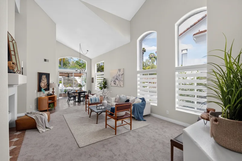 Bright living room with high ceilings and large windows