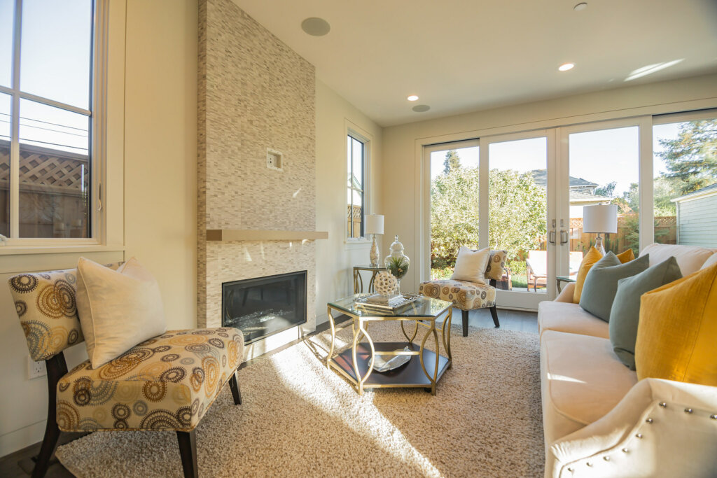 Cozy living room with fireplace, carpet and seating area. - HomeJab