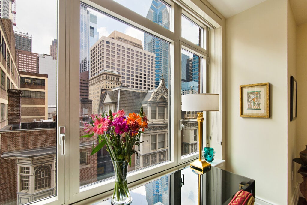 Interior photo looking out the windows onto the city of Philadelphia. 