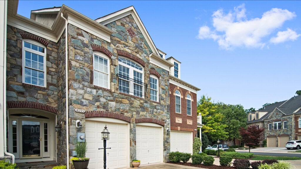 Large stone home taken using HomeJab's blue sky replacement.