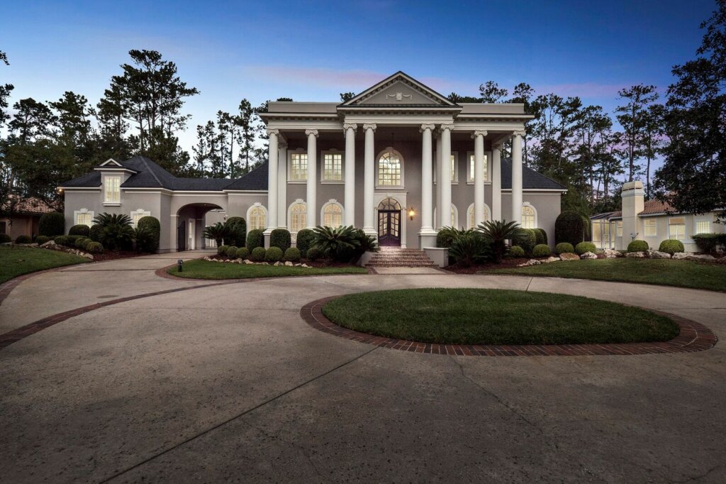 Professional photo of a mansion taken from the driveway using HomeJab's virtual dusk.