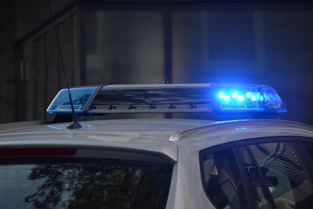 Phot of police car with blue lights on. - HomeJab