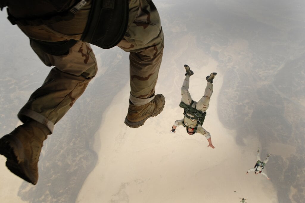 Army paratroopers areal shot falling from a plane. - HomeJab