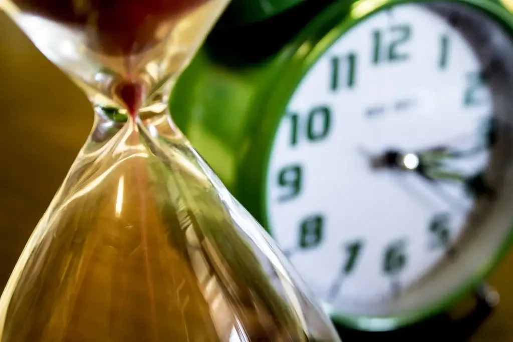 Image of a clock and hour glass. - HomeJab