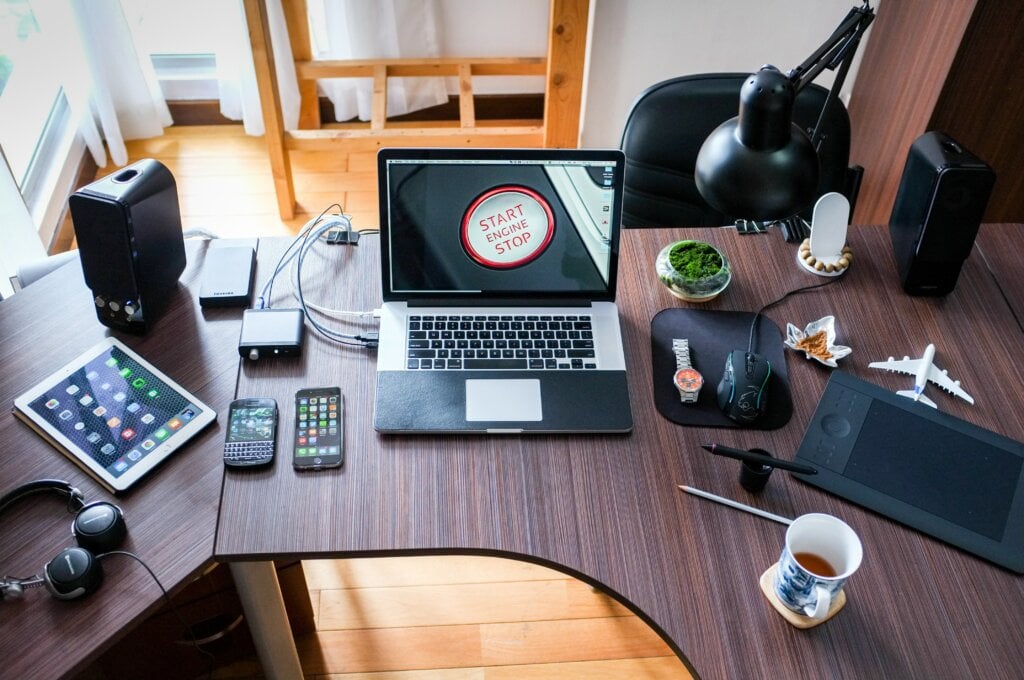 Image of a home work desk with lap top and other tools. - HomeJab