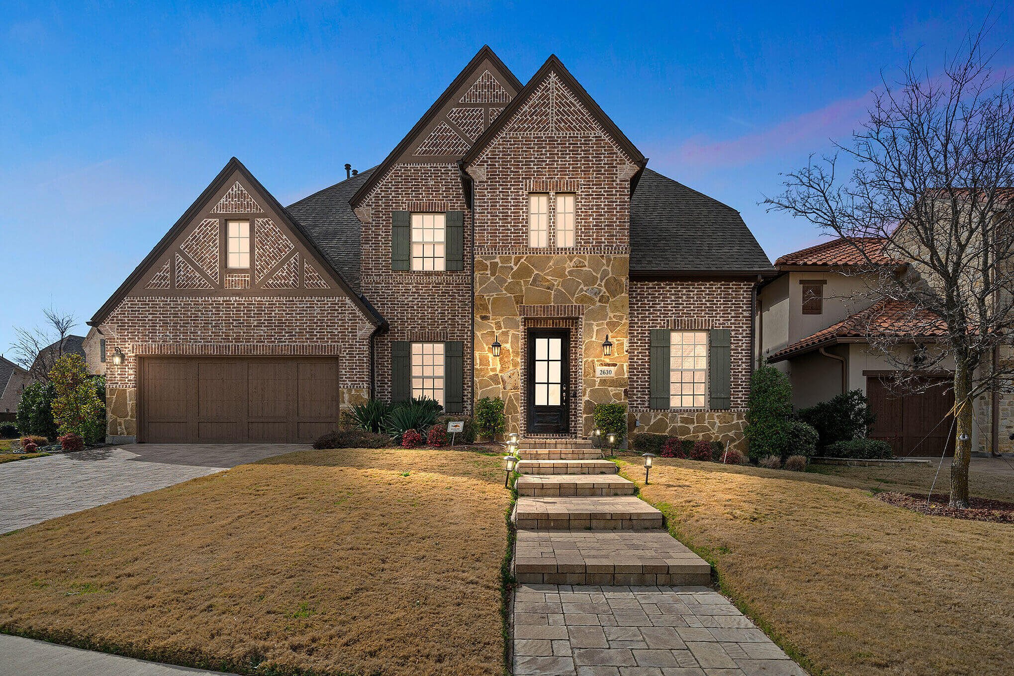 Curbside photo of a two story house by HomeJab.